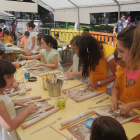 Los niños disfrutan de uno de los talleres del Parque de Mero.-ISRAEL L. MURILLO