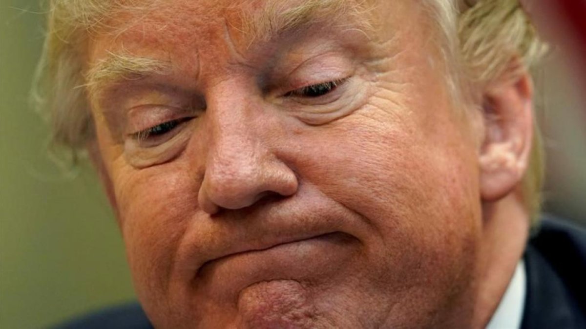 Donald Trump durante un encuentro con periodistas en el que le han preguntado por su reforma sanitaria.-KEVIN LAMARQUE