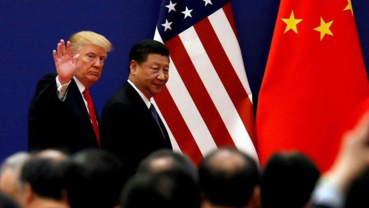 Donald Trump y Xi Jinping en una reunión oficial.-REUTERS