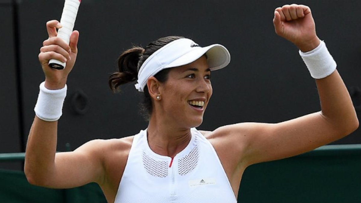Muguruza celebra su victoria en Wimbledon.-FACUNDO ARRIZABALAGA / EFE