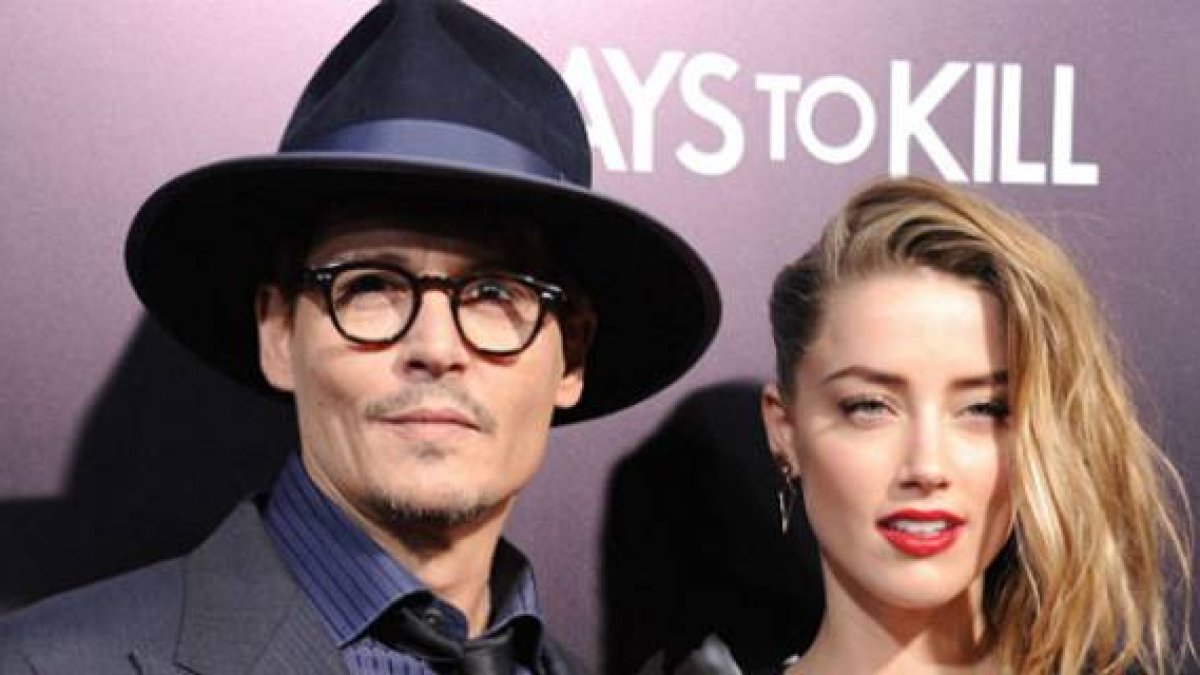 Johnny Depp y su ya esposa, Amber Heard, en una reciente 'premiere'.-Foto: AFP