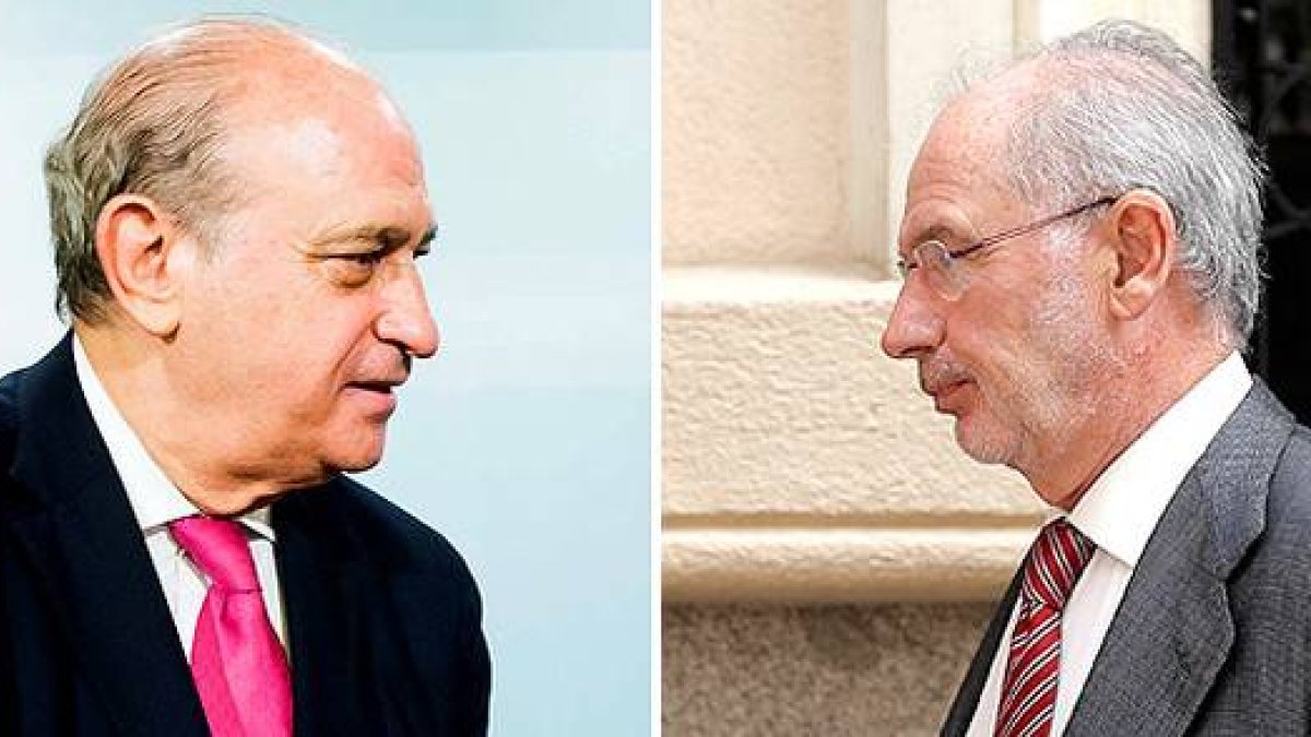 Jorge Fernández Díaz, ministro del Interior, y Rodrigo Rato, exvicepresidente del Gobierno y exministro de Economía.-JOSÉ LUIS ROCA