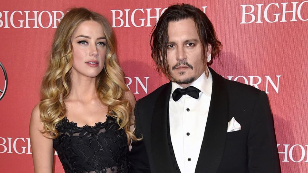 Johnny Depp y Amber Heard, el pasado enero en una gala en Palm Springs.-AP / JORDAN STRAUSS