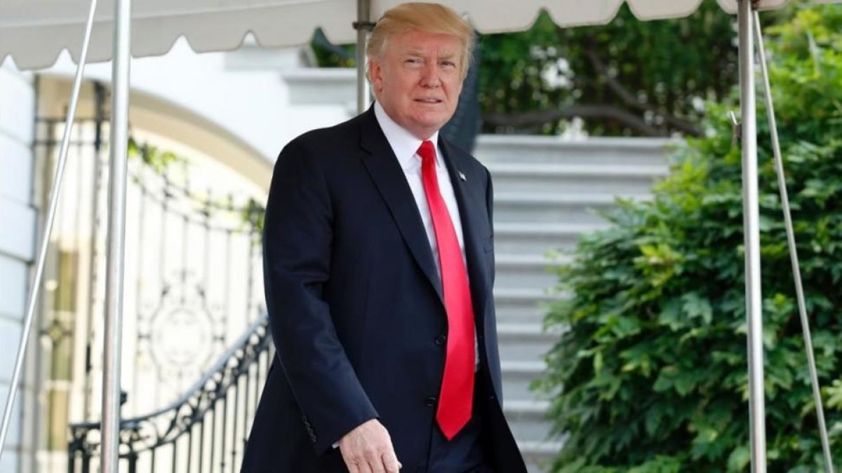 Donald Trump a las puertas de la Casa Blanca.-AFP / YURI GRIPAS