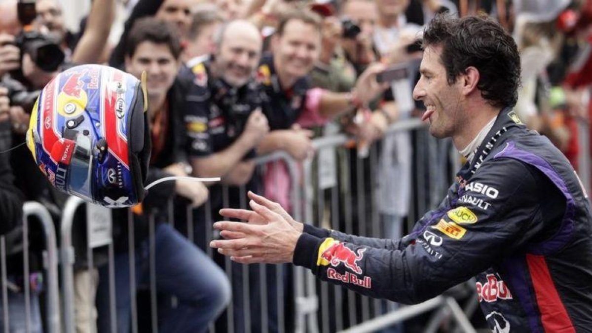Mark Webber celebra uno de sus podios con el equipo Red Bull.-AP / SILVIA IZQUIERDO