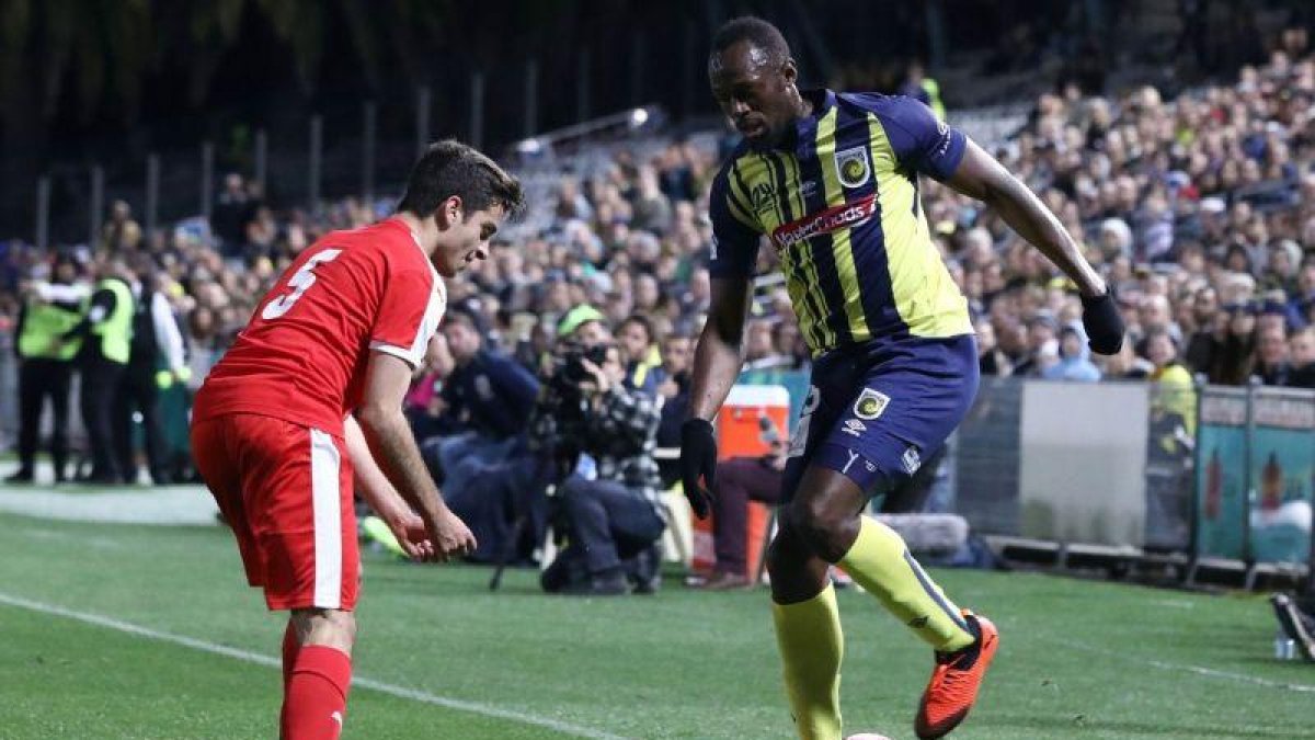 Usain Bolt, en su estreno con los Mariners.-ANDREW MURRAY / AFP