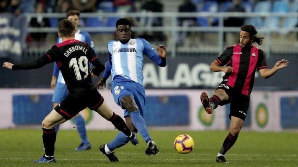 El Reus, durante su victoria ante el Málaga.-EL PERIÓDICO