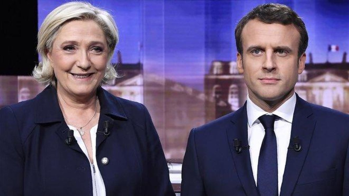 Marine Le Pen y Emmanuel Macron.-ERIC FEFERBERG POOL (AP)
