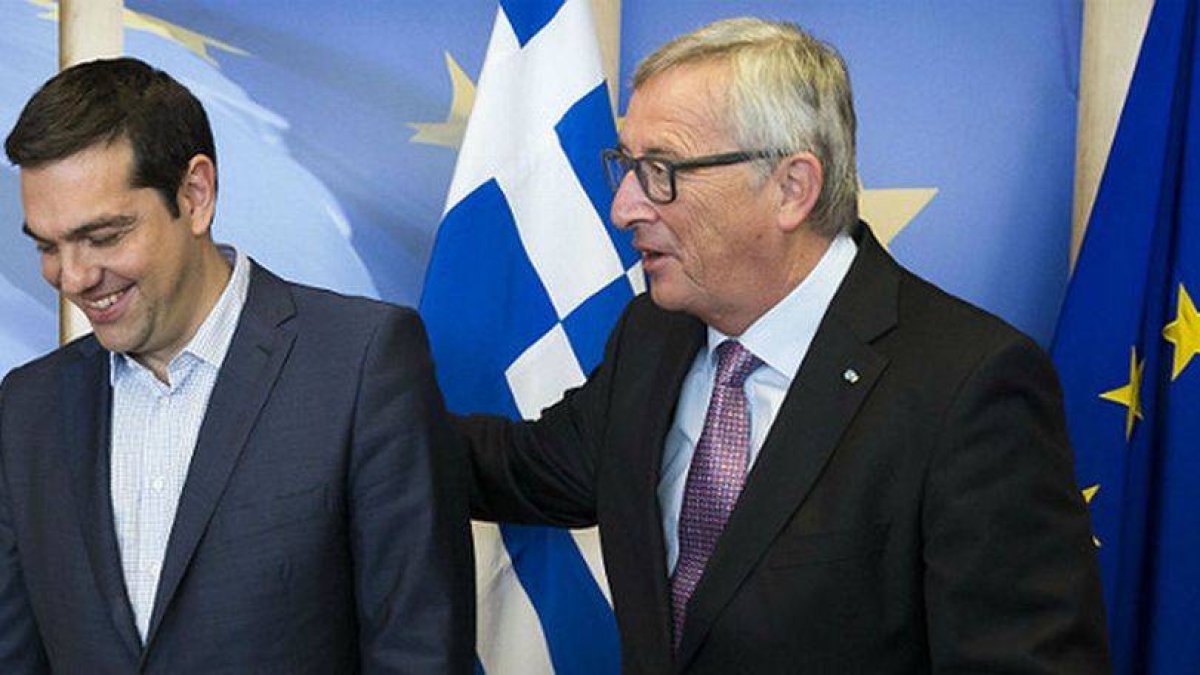 Tsipras y Jean-Claude Juncker.-Foto: AFP / JULIEN WARNARD