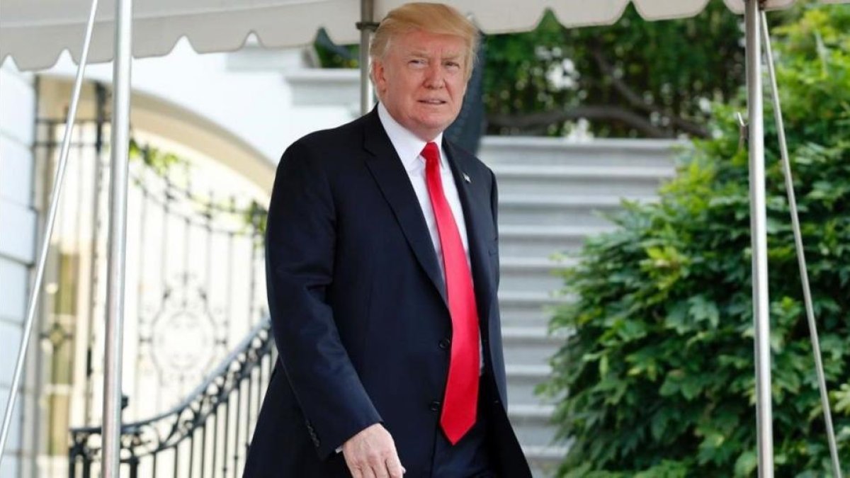Donald Trump a las puertas de la Casa Blanca.-AFP