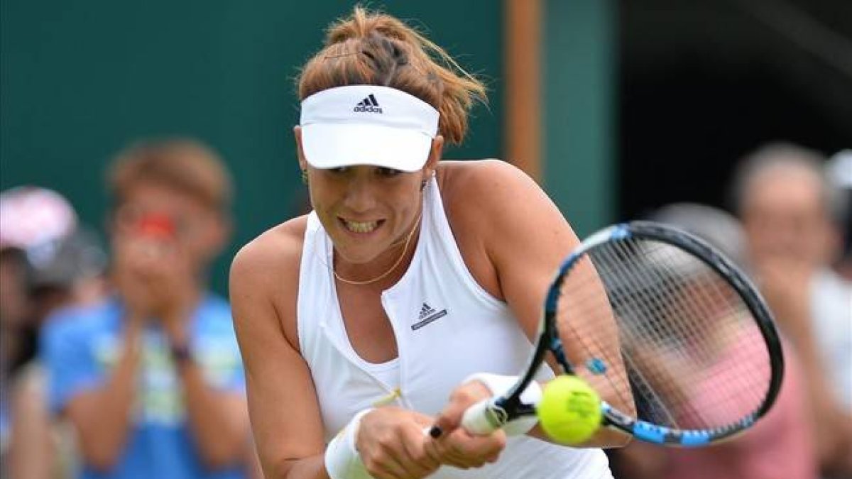Muguruza, en un momento de su partido ante Lucic.-Foto: AFP / GLYN KIRK