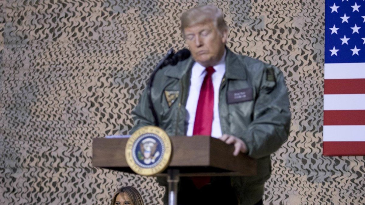 President Donald Trump speaks at a hanger rally at Al Asad Air Base Iraq Wednesday In a surprise trip to Iraq President Donald Trump on Wednesday defended his decision to withdraw-Andrew Harnik / AP