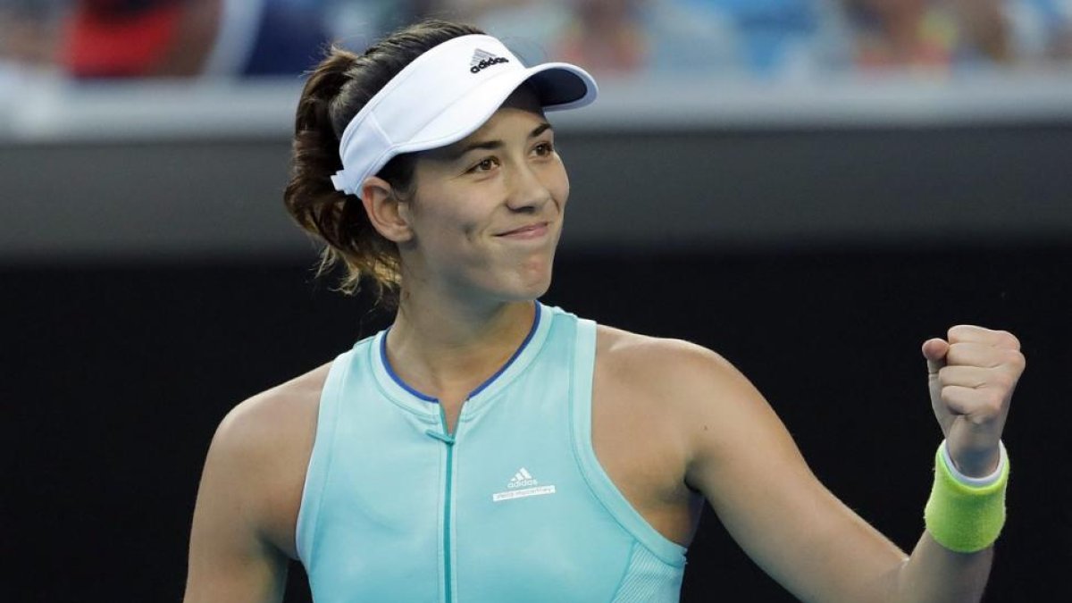 Muguruza celebra un punto ganado ante Cirstea.-MADE NAGI / EFE