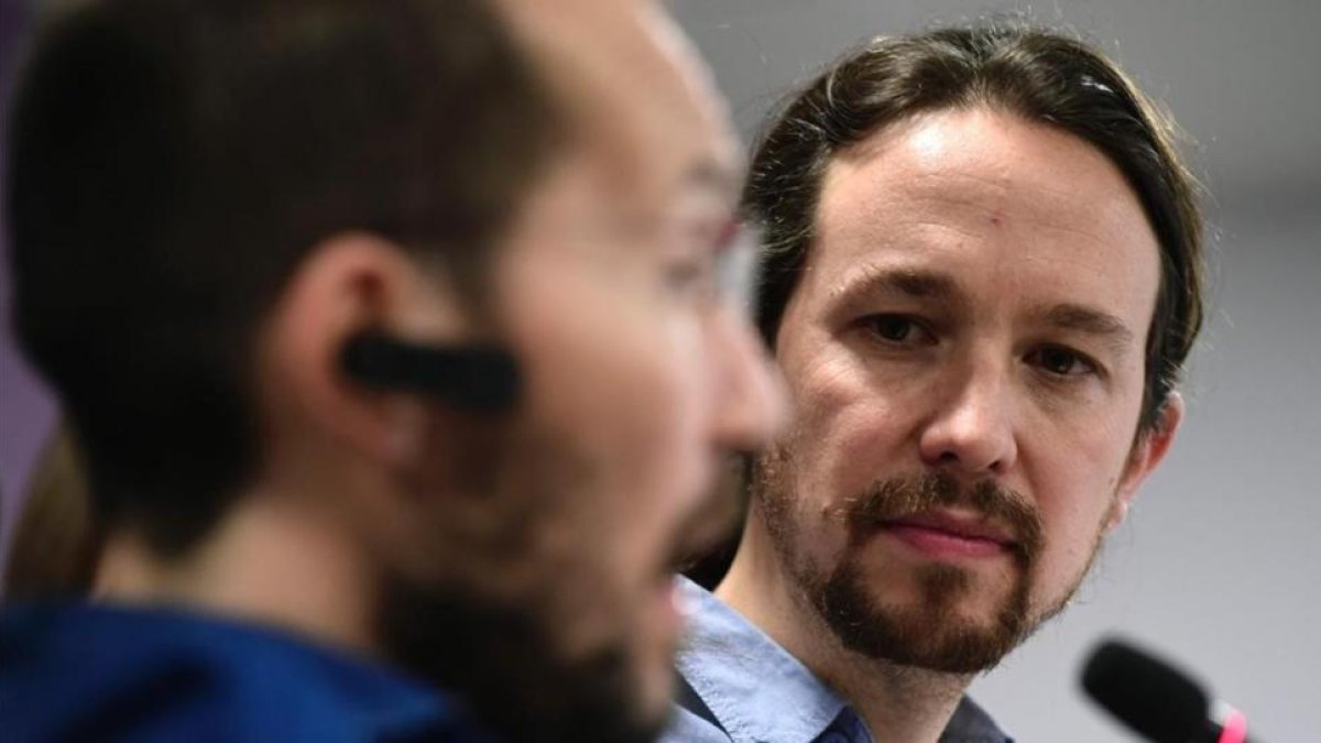 Pablo Iglesias y Pablo Echenique durante una rueda de prensa en la sede de Podemos, el pasado 18 de marzo.-AFP
