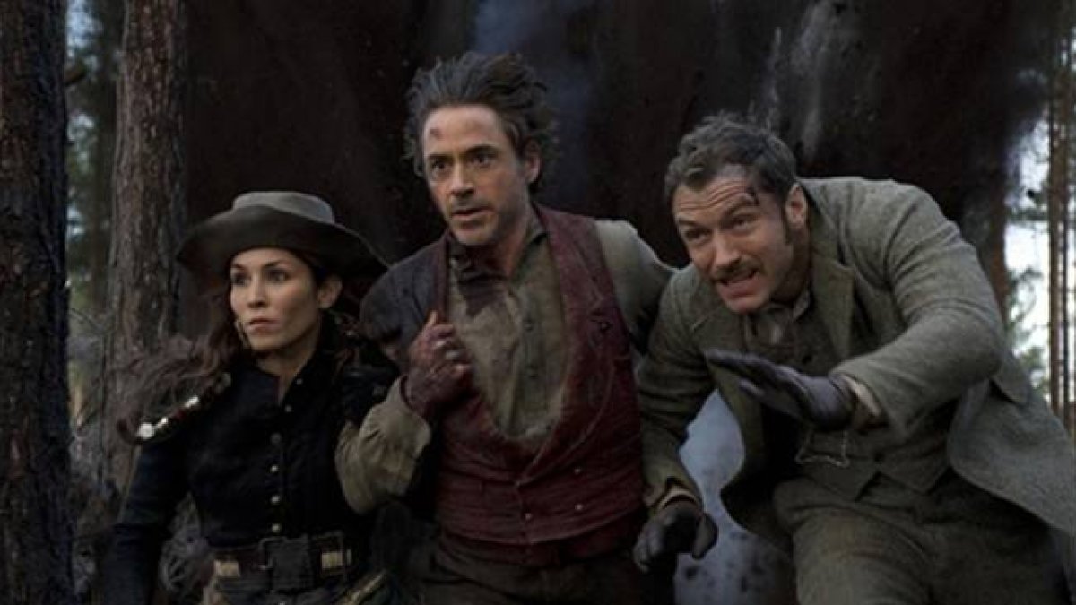 Noomi Rapace, Robert Downey Jr. y Jude Law, en 'Sherlock Holmes: juego de sombras'.-Foto: ARCHIVO