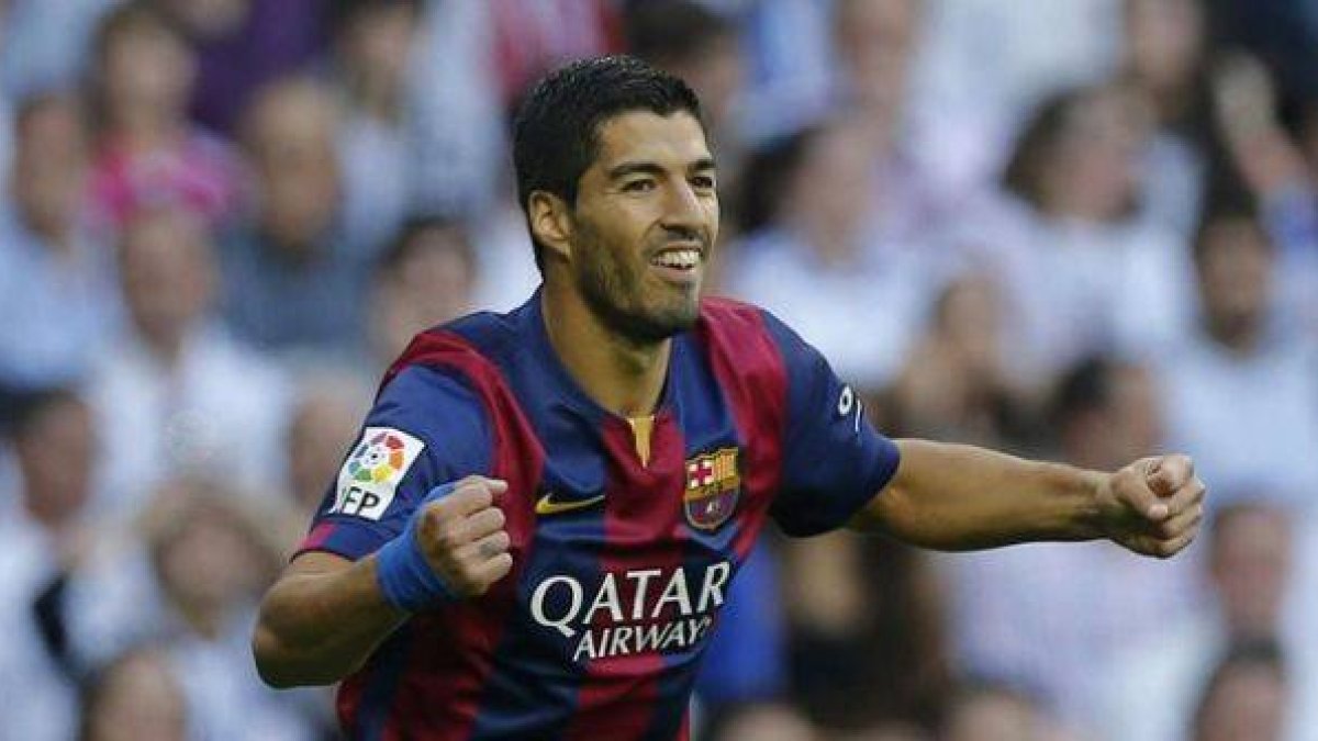 Luis Suárez celebra el gol de Neymar en el clásico.-Foto: AP / PAUL WHITE