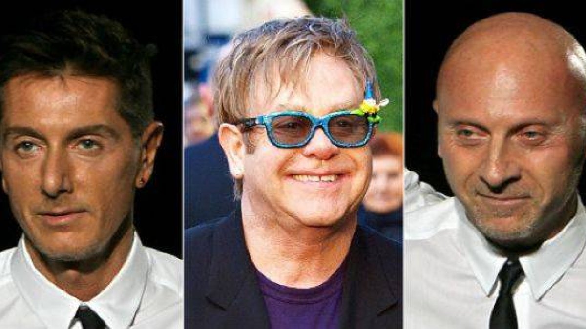 Domenico Dolce, Eltoh John y Stefano Gabbana.-