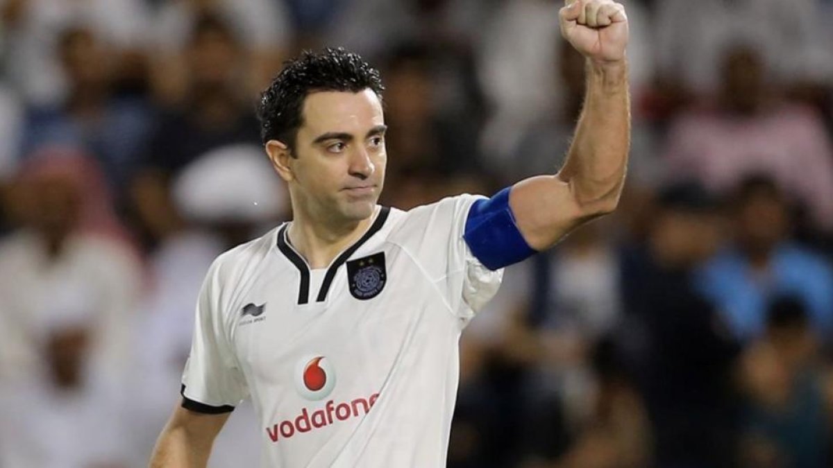 Xavi, en un partido con el Al Sadd.-AFP / KARIM JAAFAR