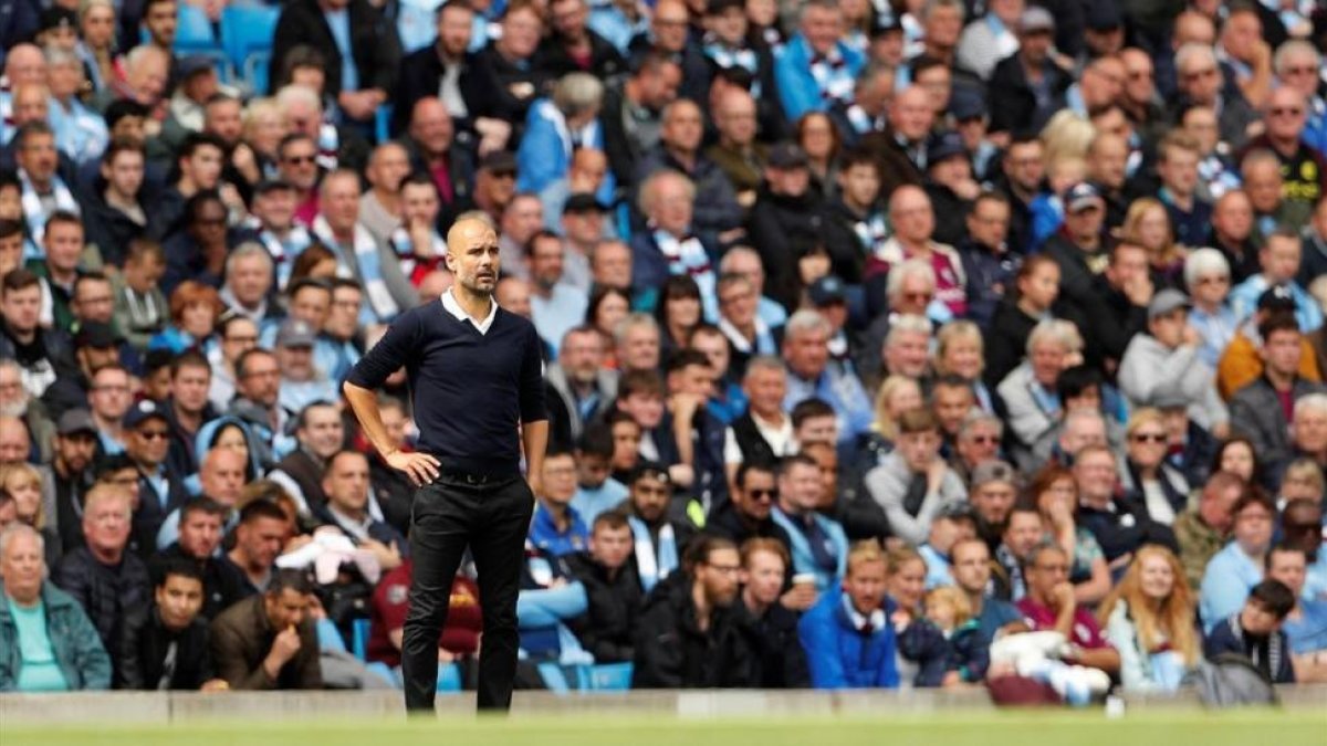 Guardiola, durante un partido de la Premier de esta temporada.-AP / LEE SMITH