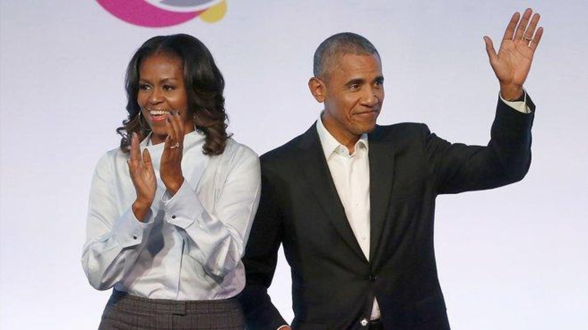 Barack y Michelle Obama.-