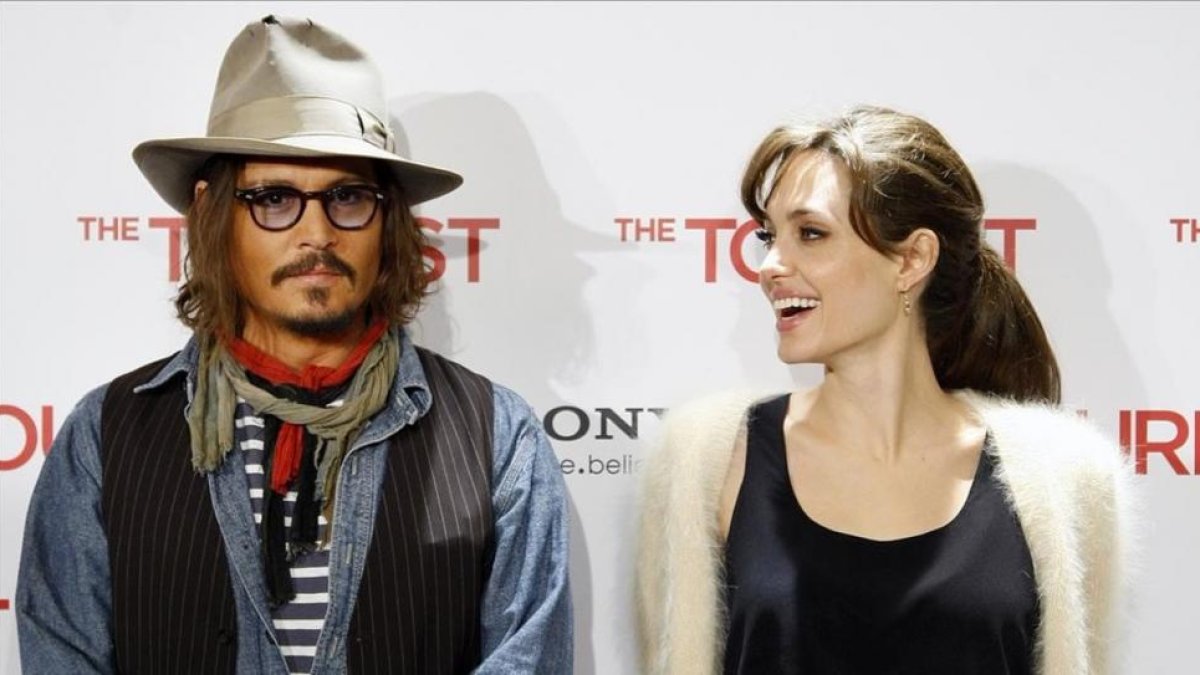 Johnny Deep y Angelina Jolie, en la presentación en Madrid de 'The Tourist', en diciembre de 2010.-DAVID CASTRO