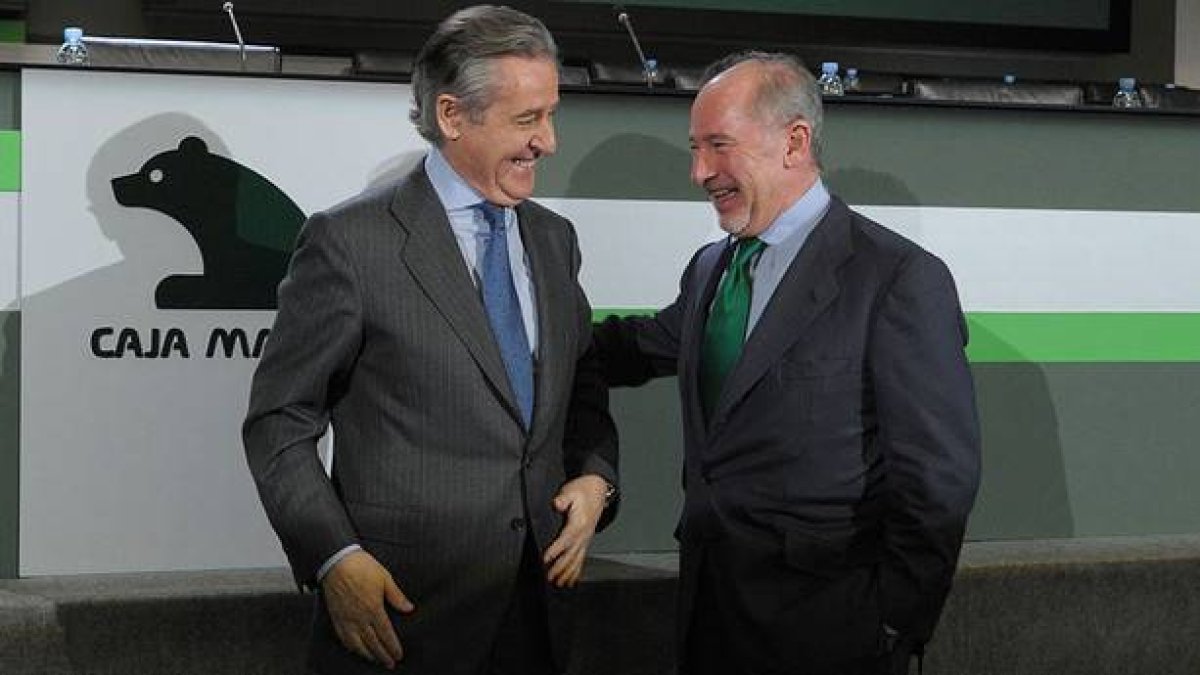 Blesa y Rato, en una asamblea general extraordinaria de Caja Madrid.-CAJA MADRID