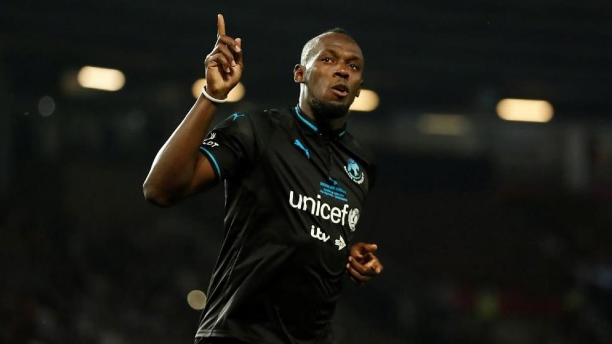 Usain Bolt celebra su gol en la tanda de penaltis-ANDREW BOYERS