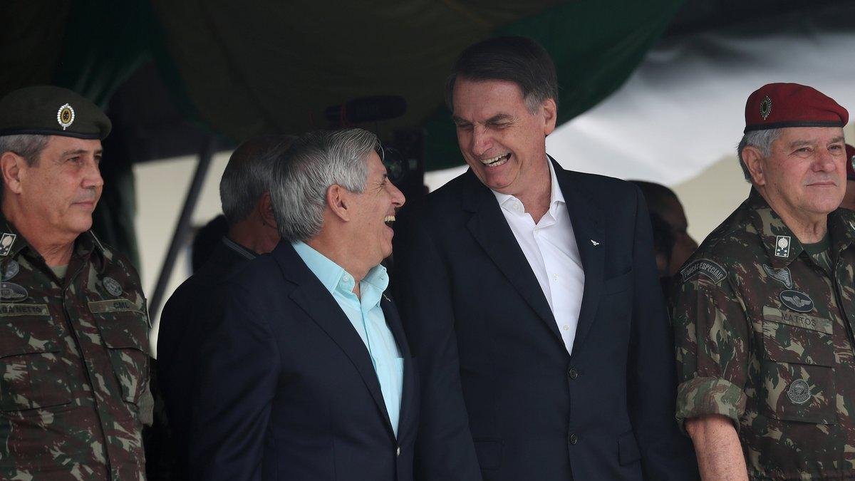 Brazil s President-elect Jair Bolsonaro waves at supporters as he arrives to watch an aerial performance by the private pilots group a Esquadrilha do Ceu or a Sky Squadron at Barra beach in Rio de Janeiro Brazil .-Leo Correa / AP