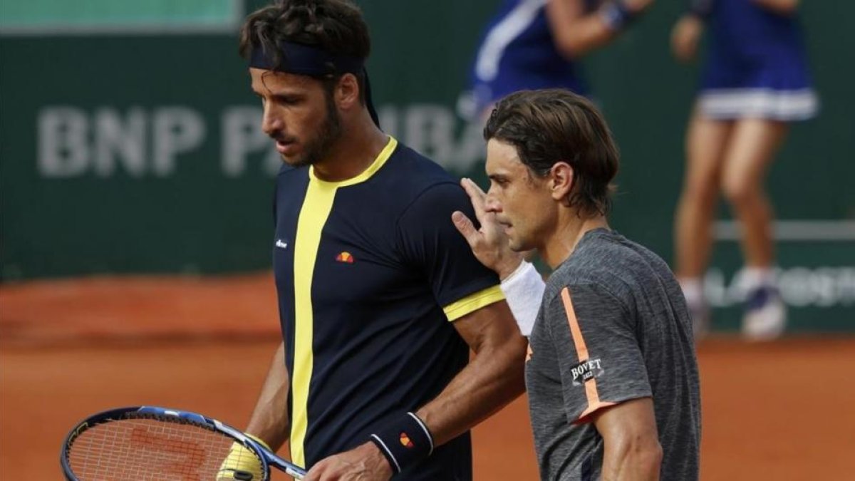 Ferrer y Feliciano, tras su partido del sábado en Roland Garros. El alicantino irá a Río, y el toledano ha renunciado por cuestión de calendario.-REUTERS / PASCAL ROSSIGNOL