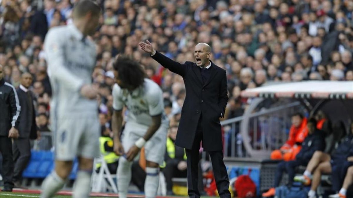 Marcelo, durante el partido del sábado ante el Málaga en el que cayó lesionado.-AP / FRANCISCO SECO