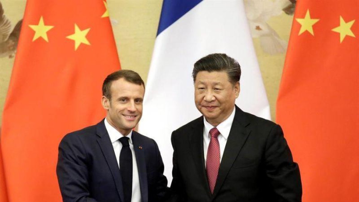 El presidente Xi Jinping y el presindente Emmanuel Macron.-EFE