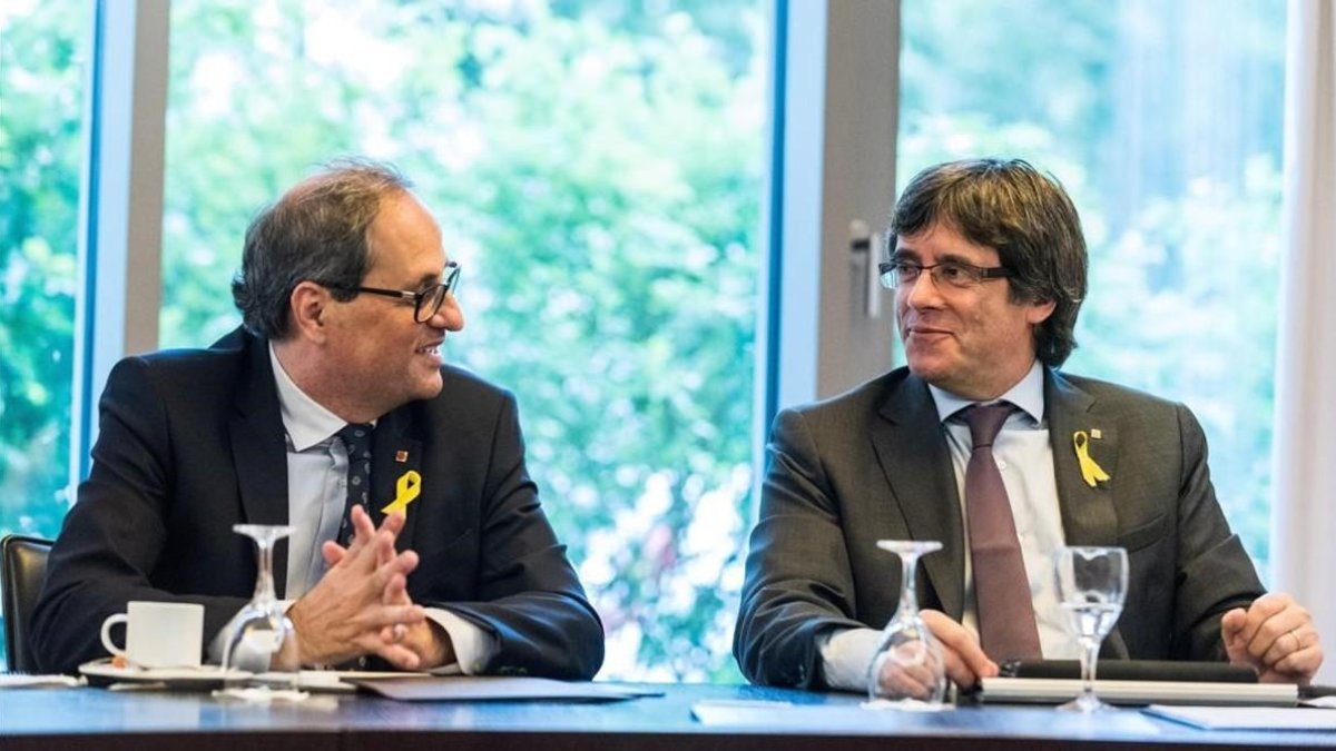 El president de la Generalitat, Quim Torra, y el expresidente Carles Puigdemont, en un encuentro en Berlín el pasado junio.-MARKUS HEINE