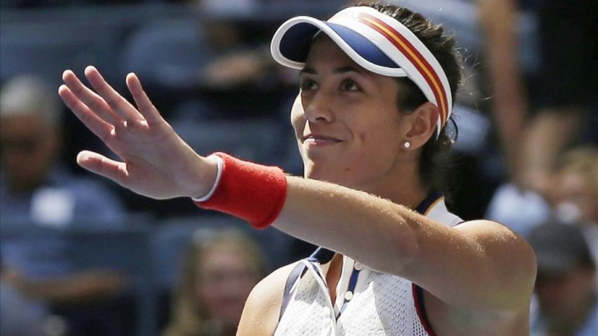 Muguruza saluda tras una victoria en el Abierto de EEUU, este año-AP / SETH WENIG
