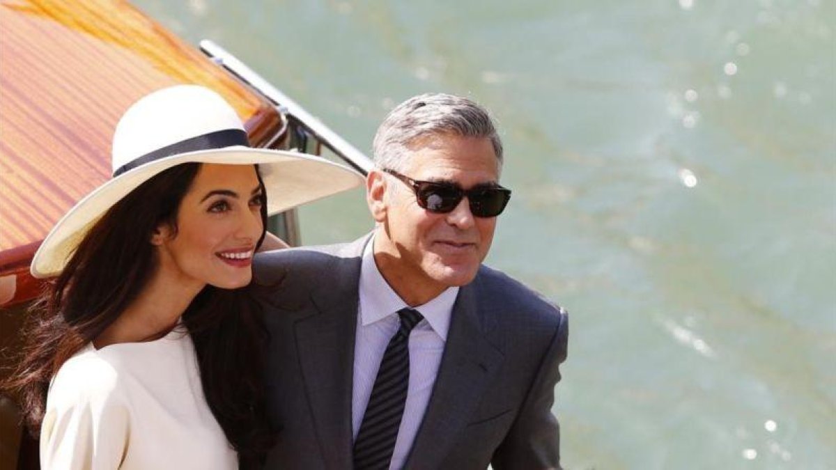Amal y George Clooney, durante una visita al Festival de Venecia del 2014. Italia es la otra patria del intérprete norteamericano.-PIERRE TEYSSOT