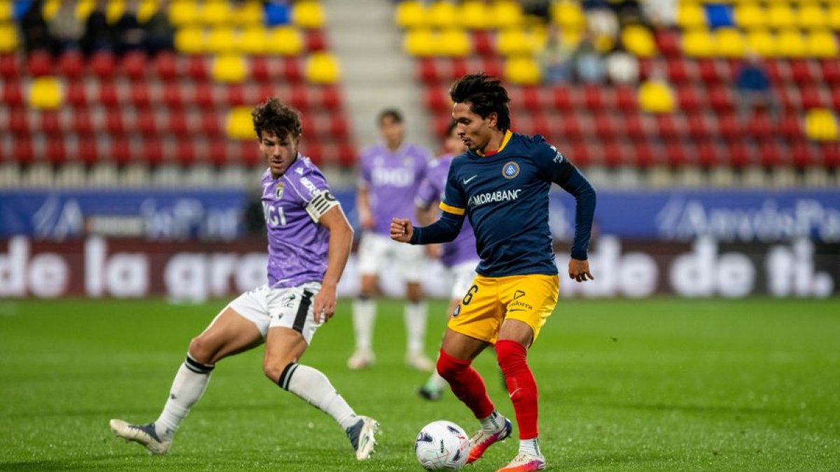 Curro Sánchez y Schneider, durante el partido.
